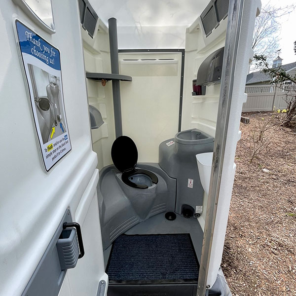 Interior view of a deluxe portable restroom with sink in NJ & NY